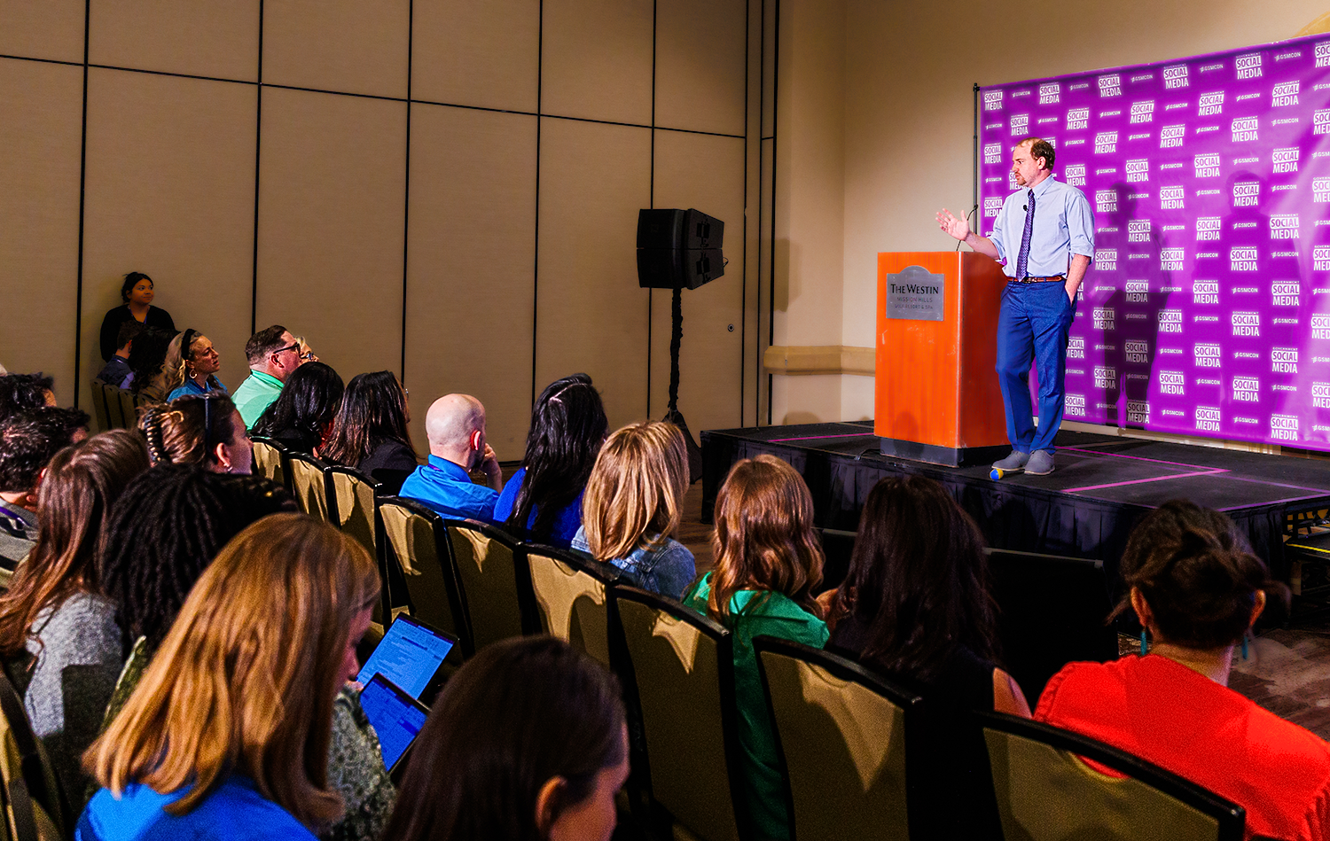 GSMCON Breakout Session with speaker onstage and seated audience in the foreground.